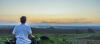 Man relaxing in the countryside after taking the adaptogen ashwagandha root