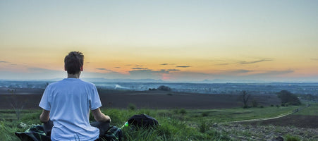 Man relaxing in the countryside after taking the adaptogen ashwagandha root